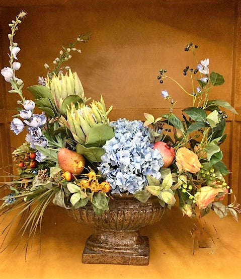 Floral Arrangement with Light Blue Delphinium, Hydrangea, Green Protea, Gold pear/Pomegranate, Red Rose Hips - April's Garden